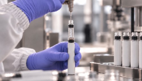 Gloved hands handling a pen in a laboratory